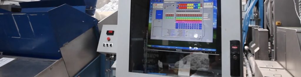 Softrol systems screen surrounded by Softrol machinery